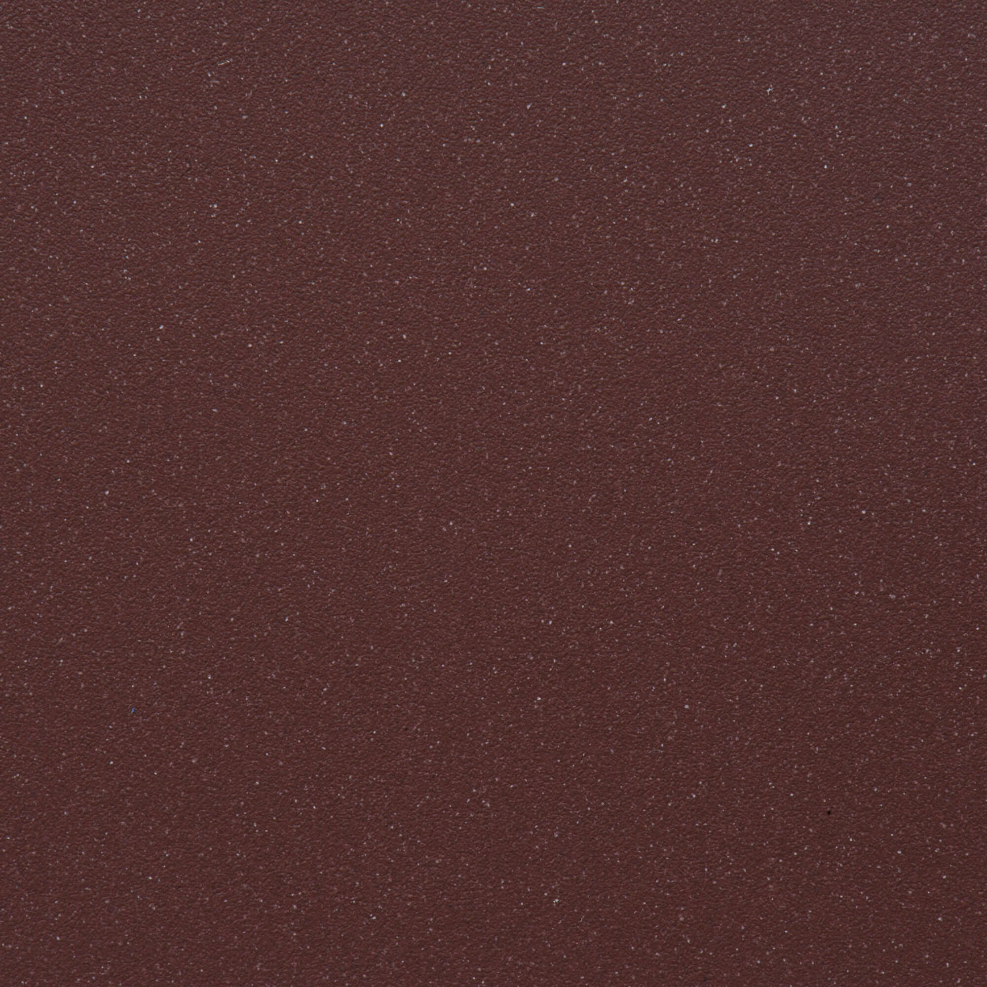 Close-up of the textured red surface for Ruvati epiGranite sink RVG2033, showcasing a subtle shimmer and fine particles