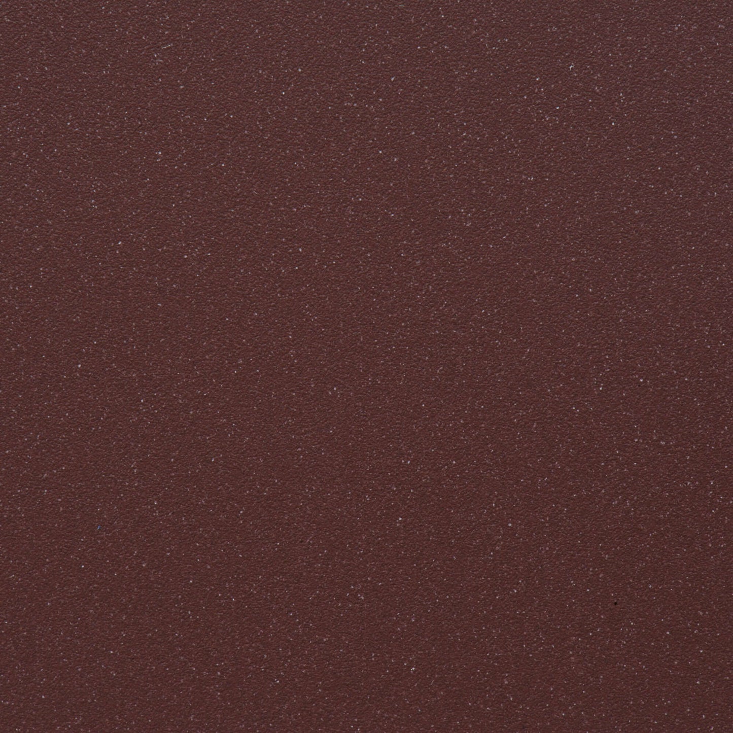 Close-up of the textured red surface for Ruvati epiGranite sink RVG2033, showcasing a subtle shimmer and fine particles