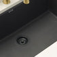 Ruvati 32" epiGranite undermount kitchen sink in Midnight Black with gold faucet in a modern kitchen setting