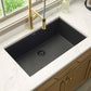 Ruvati 32" epiGranite undermount kitchen sink in Midnight Black with gold faucet and handles in a modern kitchen setting.