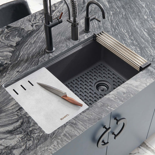Ruvati epiStage 33" Workstation Granite Kitchen Sink RVG2302BK with cutting board and knife on elegant granite countertop.