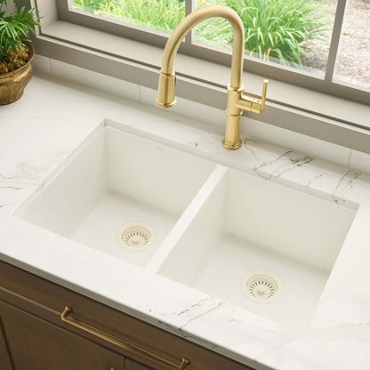 Ruvati RVG2388 32" Granite Composite Undermount Double Bowl Sink installed in a marble countertop with a gold faucet.