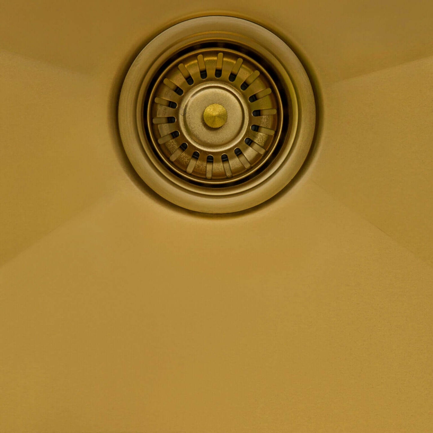 Ruvati 25" Terraza Nano-PVD Topmount Kitchen Sink Single Bowl - RVH5007 close-up of sink drain in Matte Gold finish.