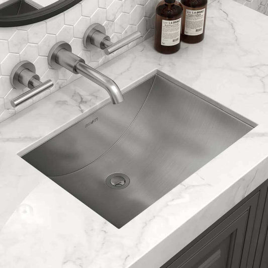 Ruvati 16" x 13" Ariaso Arc Bowl Bathroom Sink Undermount - RVH6106 installed in marble countertop.