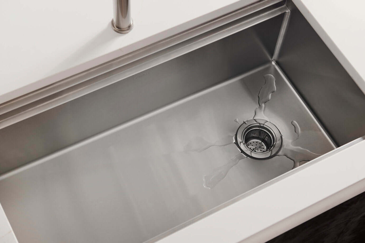 Ruvati 33" Dual-Tier Pro Workstation Kitchen Sink Undermount - RVH6222 with water splashing in the basin.