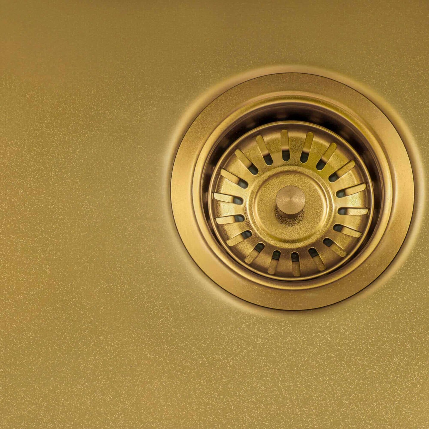 Ruvati 15" Terraza Nano-PVD Bar Prep Sink Undermount - RVH7015 showing a close-up of the drain in a sleek gold finish.