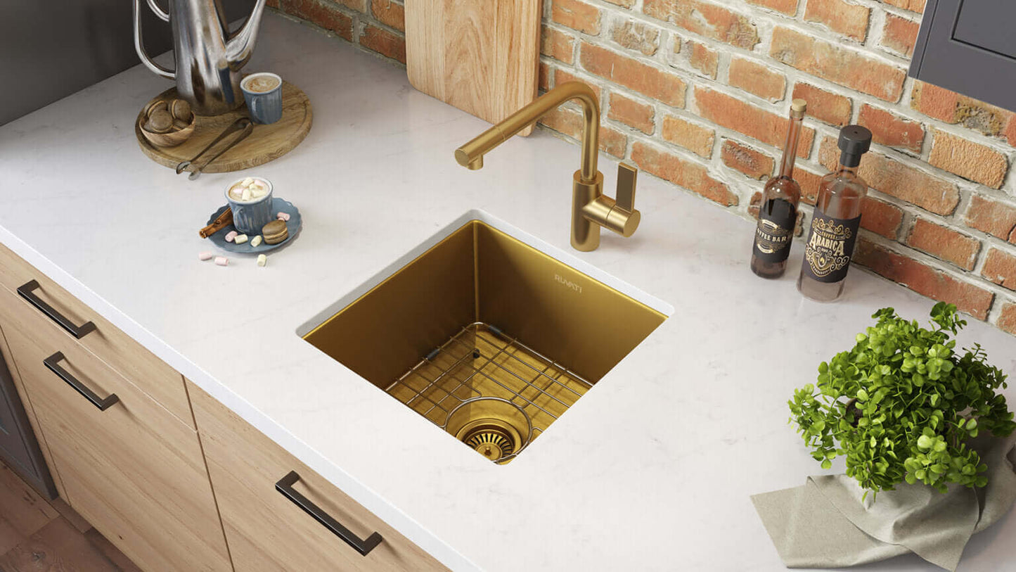 Ruvati 15" Terraza Nano-PVD Bar Prep Sink Undermount - RVH7015 installed in a modern kitchen with gold faucet.