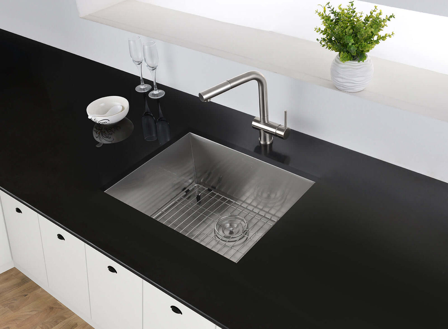 Ruvati 23" Nesta Zero Radius Bar Prep Sink Undermount - RVH7100 installed in a modern black countertop kitchen.