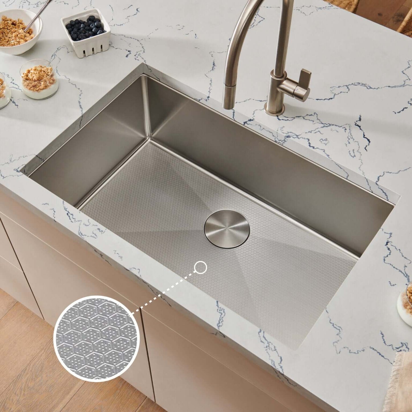 Ruvati 30" Gravena Hex Kitchen Sink Undermount - RVH7630 installed in a modern kitchen countertop with hexagonal pattern