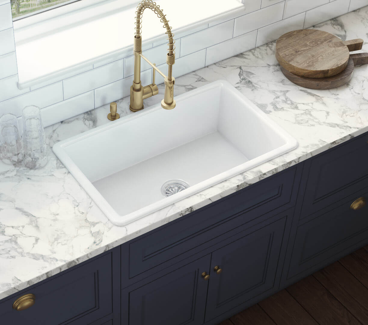 Ruvati 27" Fireclay Dual-Mount Kitchen Sink Single Bowl - RVL2707 on marble countertop with brass faucet