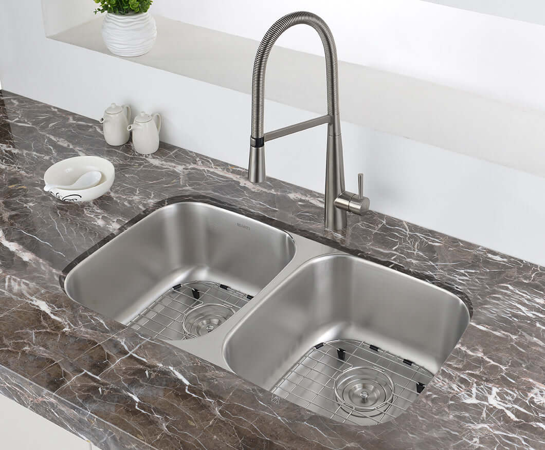 Ruvati 32" Undermount Kitchen Sink 50/50 Double Bowl - RVM4300 installed in a modern kitchen with marble countertop.