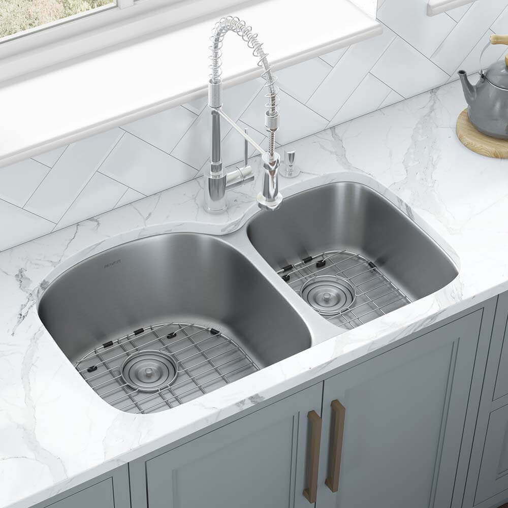 Ruvati 34" Undermount Kitchen Sink 60/40 Double Bowl - RVM4600 with polished stainless steel finish and reversible sink grid.