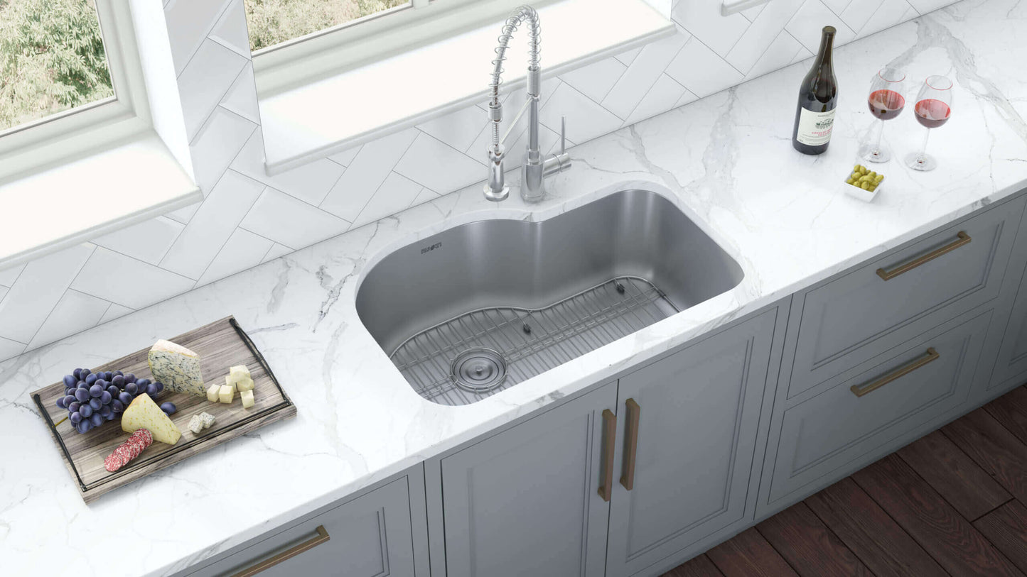 Ruvati 32" Undermount Kitchen Sink Single Bowl - RVM4700 installed in a modern kitchen with marble countertop and stylish faucet.