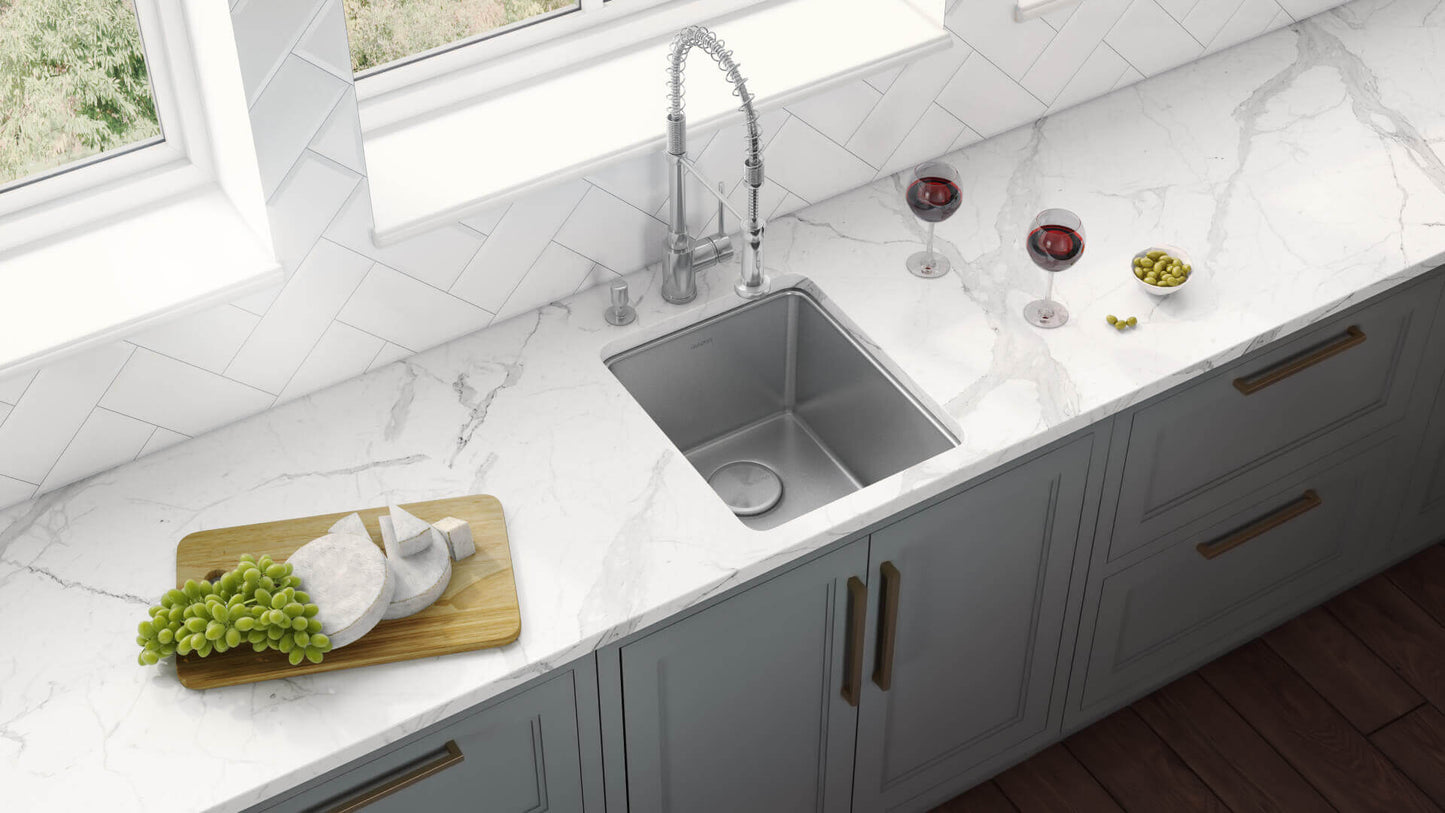 Ruvati 15" Undermount Bar Prep Kitchen Sink Single Bowl - RVM5815 in a modern kitchen setting with wine and grapes.