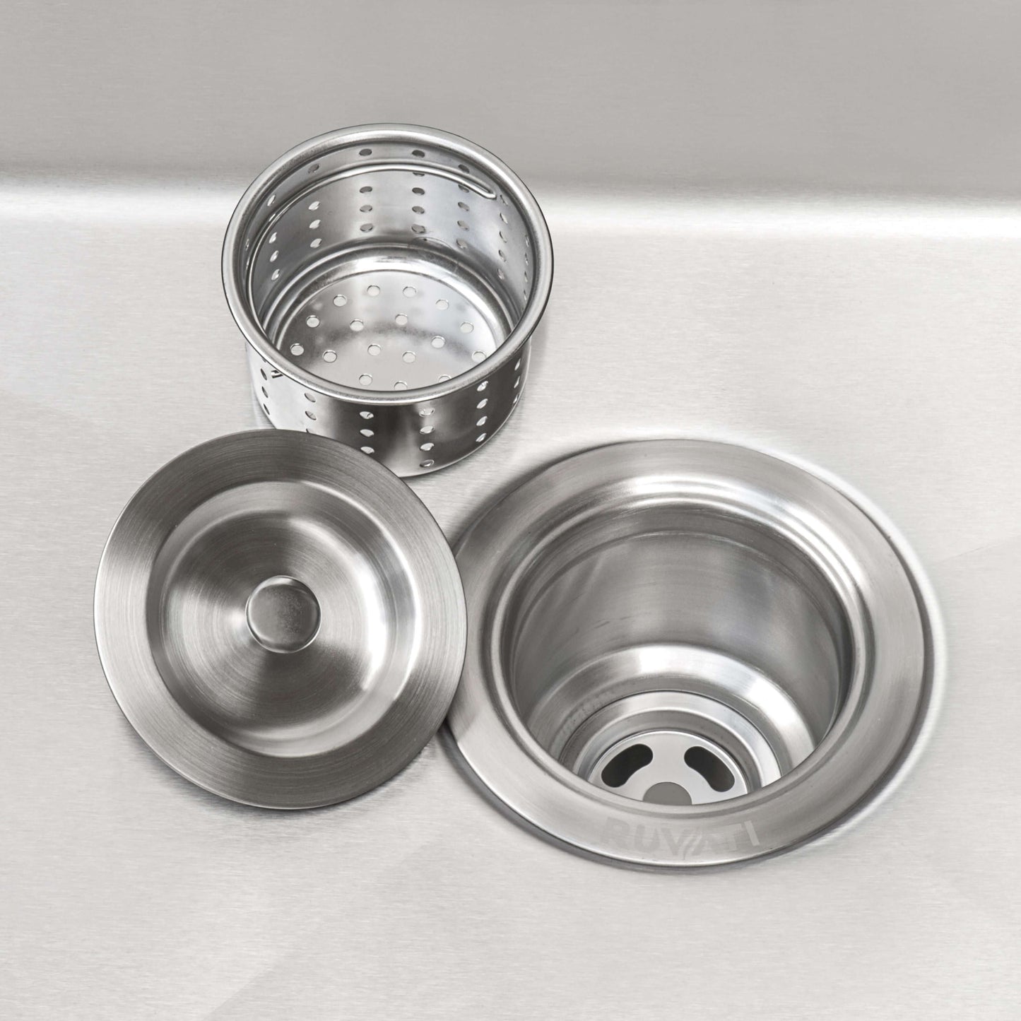Ruvati 23" Deep Laundry Utility Sink Undermount - RVU6100 sink strainers and drain components in stainless steel.