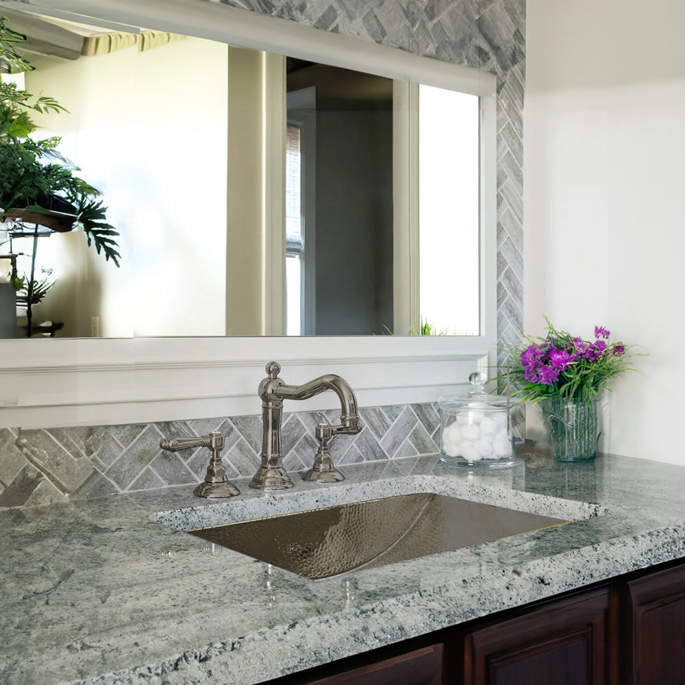 Nantucket hammered stainless steel trough bathroom sink TRS in a bathroom vanity