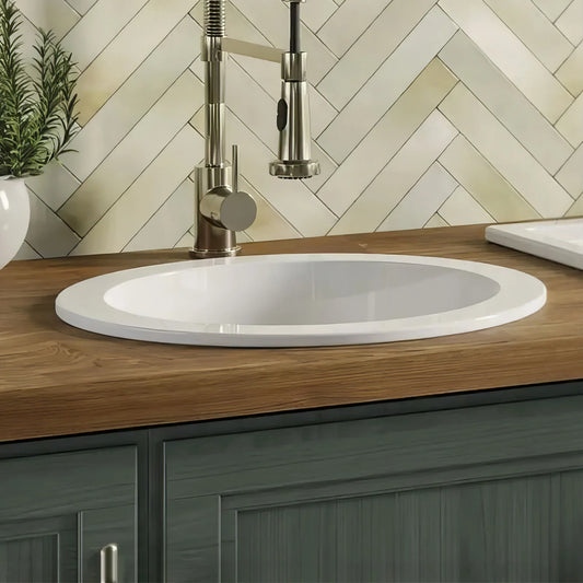 WHITEHAUS 18.25" Elementhaus Fireclay Circular Drop In/Undermount Sink with 3 ½" Rear Center Drain WHE1818R in modern kitchen