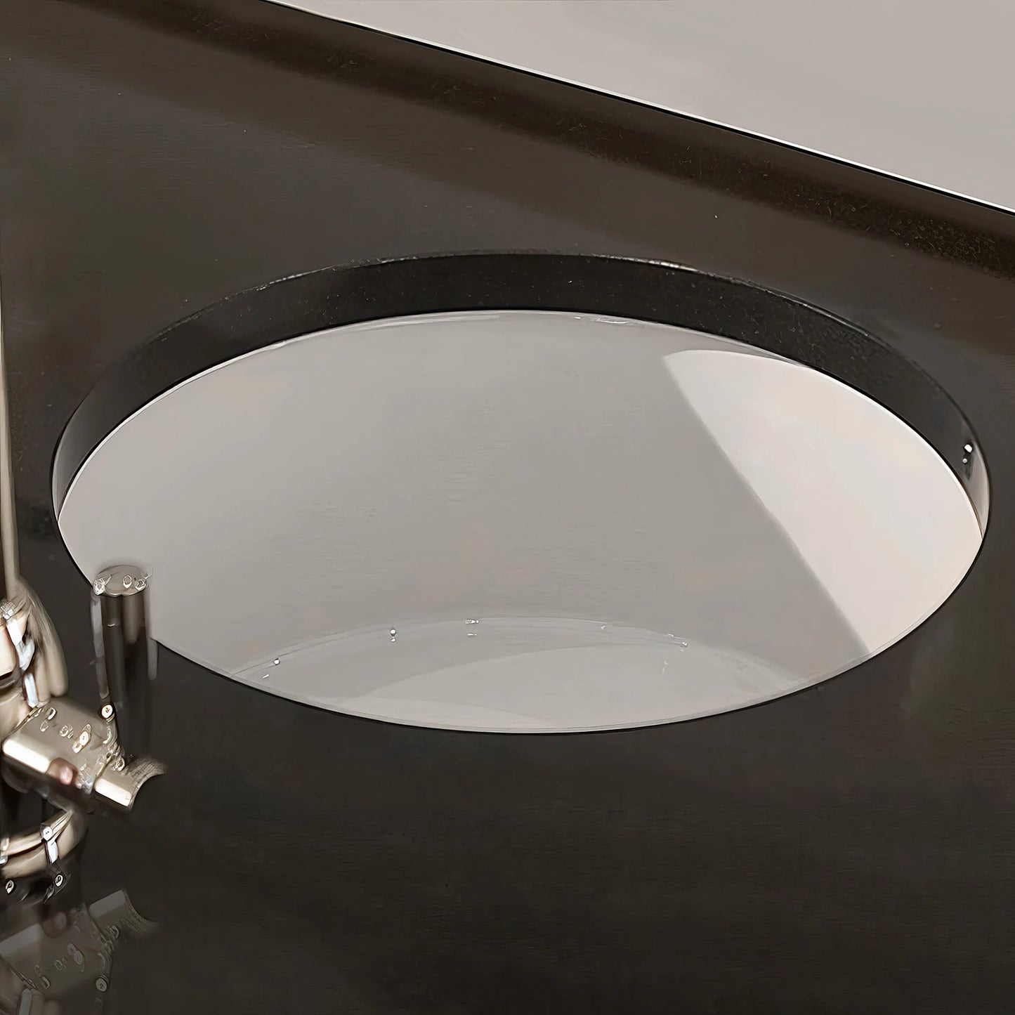 WHITEHAUS 18.25" Elementhaus Fireclay Circular Drop In/Undermount Sink with 3 ½" Rear Center Drain WHE1818R installed in countertop.