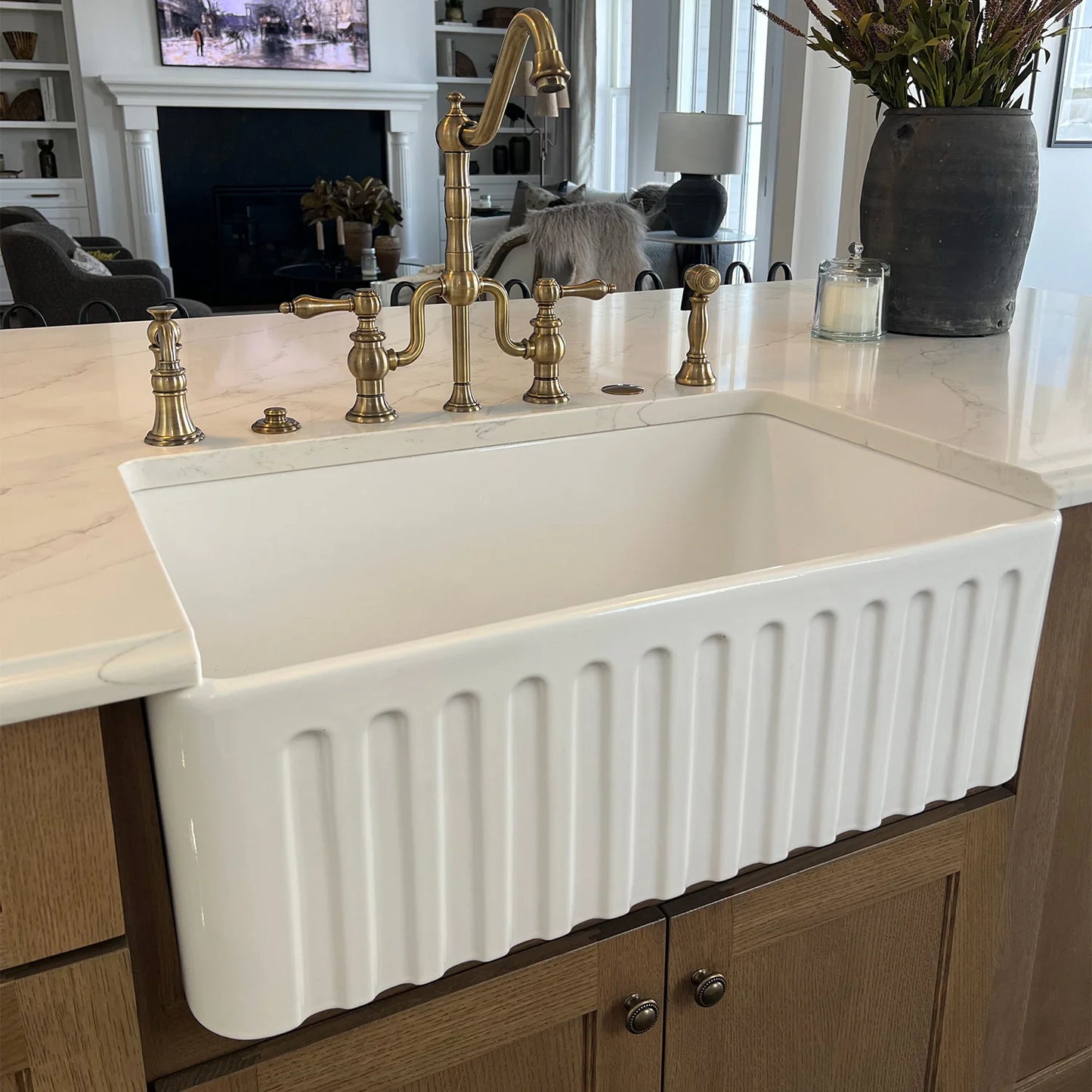 WHITEHAUS 30" Farmhaus Fireclay Reversible Sink WHFLGO3018 featuring a classic fluted design and elegant faucet.