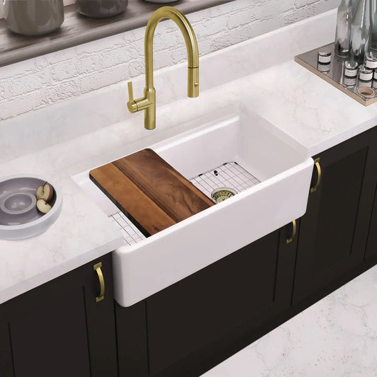 Whitehaus Fireclay 33" Farmhouse Single Basin Fireclay Kitchen Sink with Basin Rack and Cutting Board in modern kitchen setting.