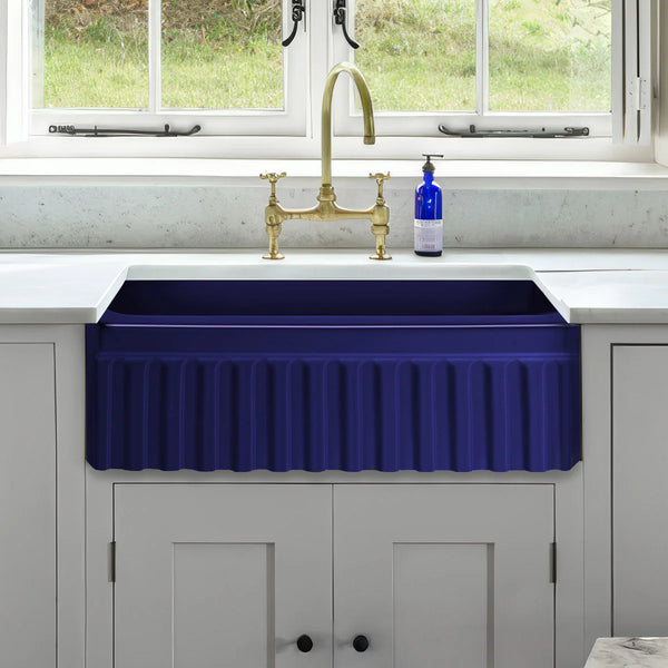 Whitehaus blue fluted farmhouse sink illustrating a typical farmhouse sink