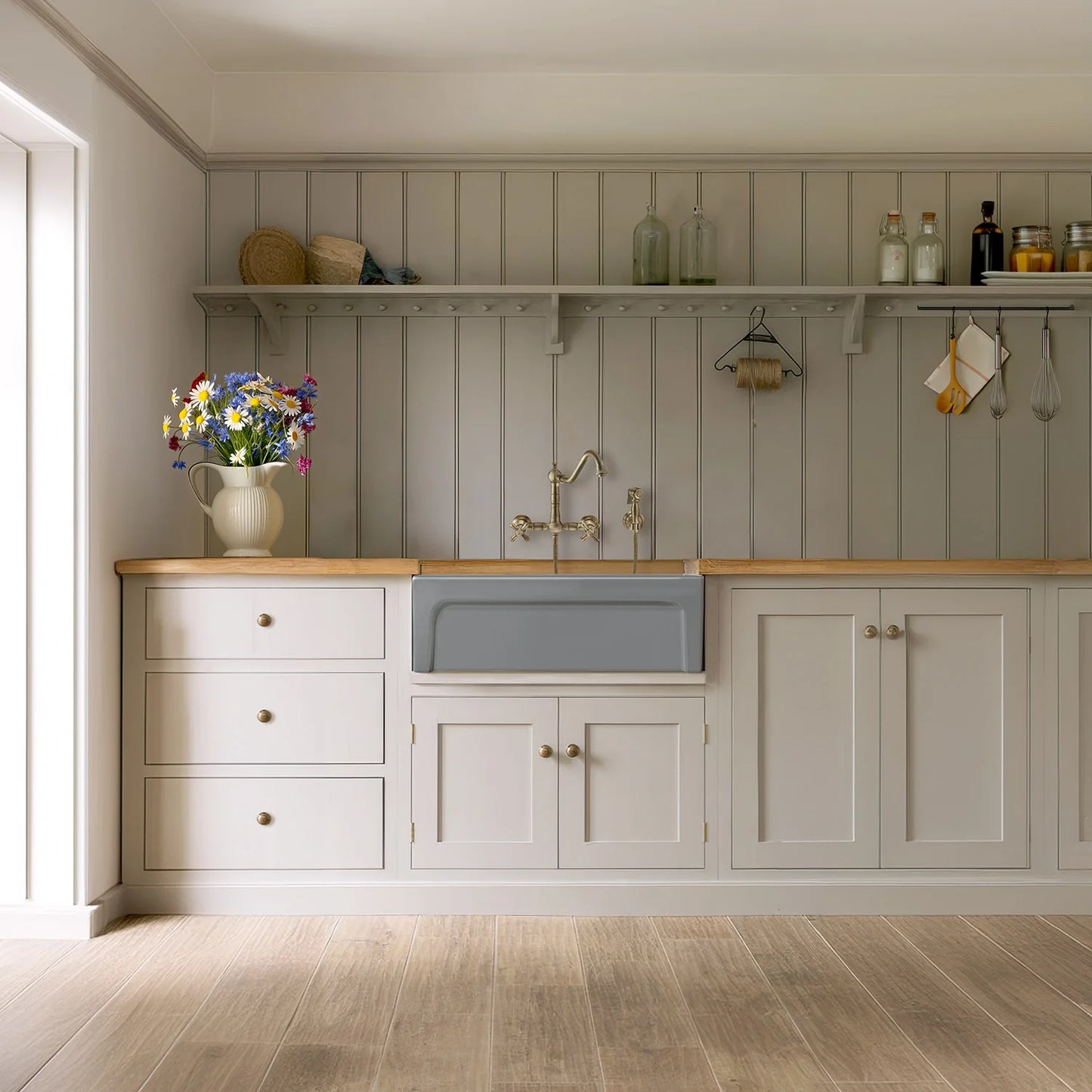 WHITEHAUS 30" Glencove Reversible Matte White Fireclay Kitchen Sink - WHQ5530 displayed in a chic coastal kitchen.