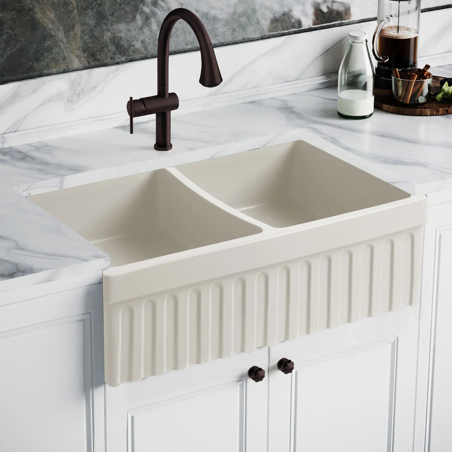 WHITEHAUS 33" Farmhaus Quatro Alcove Reversible Matte Double Bowl Fireclay Kitchen Sink WHQDB332 on a marble countertop.