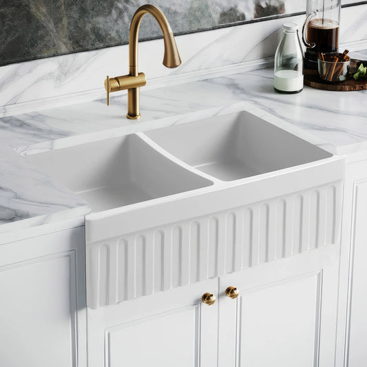 WHITEHAUS 33" Farmhaus Quatro Alcove Reversible Matte Double Bowl Fireclay Kitchen Sink WHQDB332 installed in a modern kitchen.