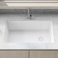 Ruvati 32" epiGranite undermount single bowl kitchen sink in Arctic White on a modern countertop with apples.