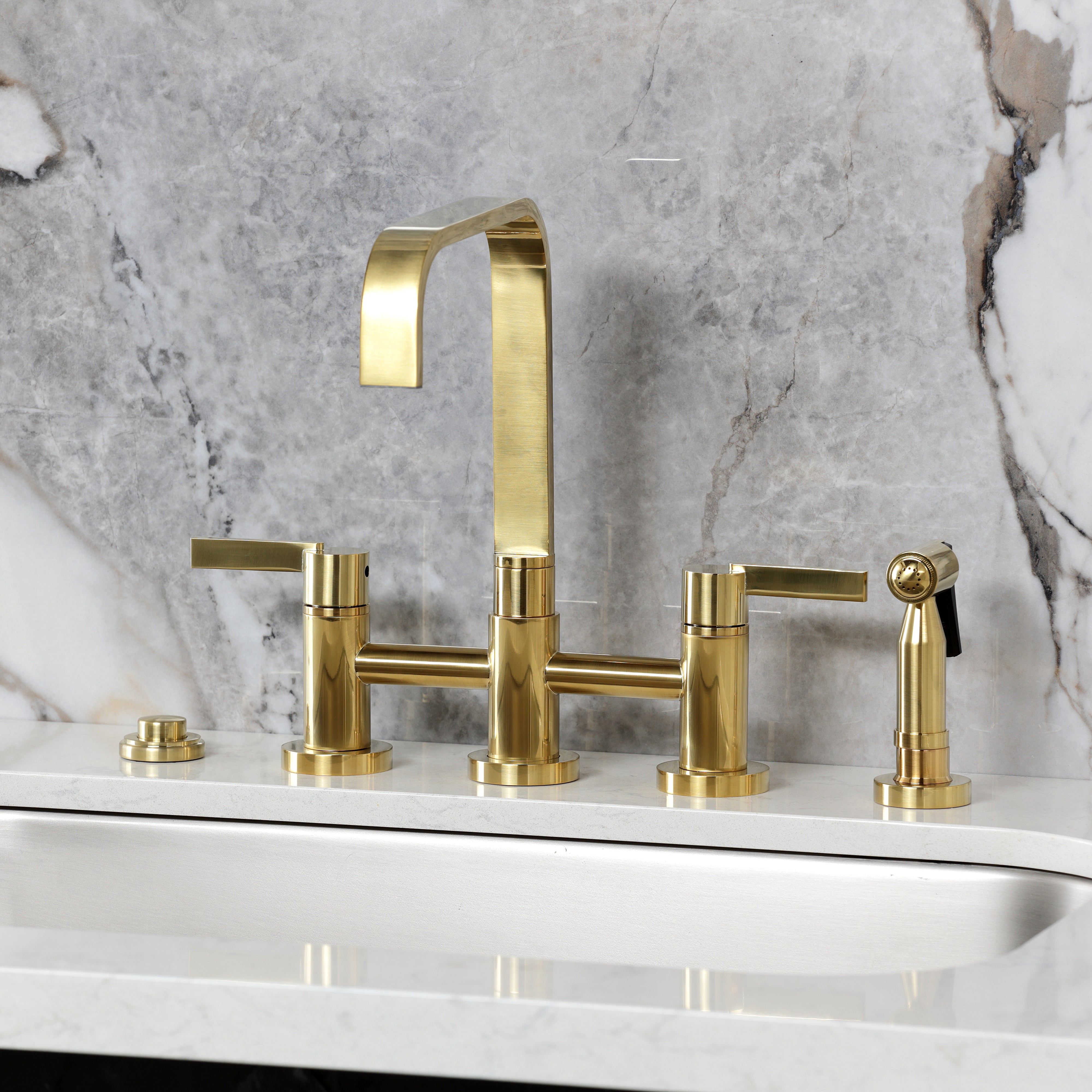 Kingston KS8257CTLBS Continental Bridge Kitchen Faucet with Brass Sprayer, Brushed Brass on modern marble countertop.