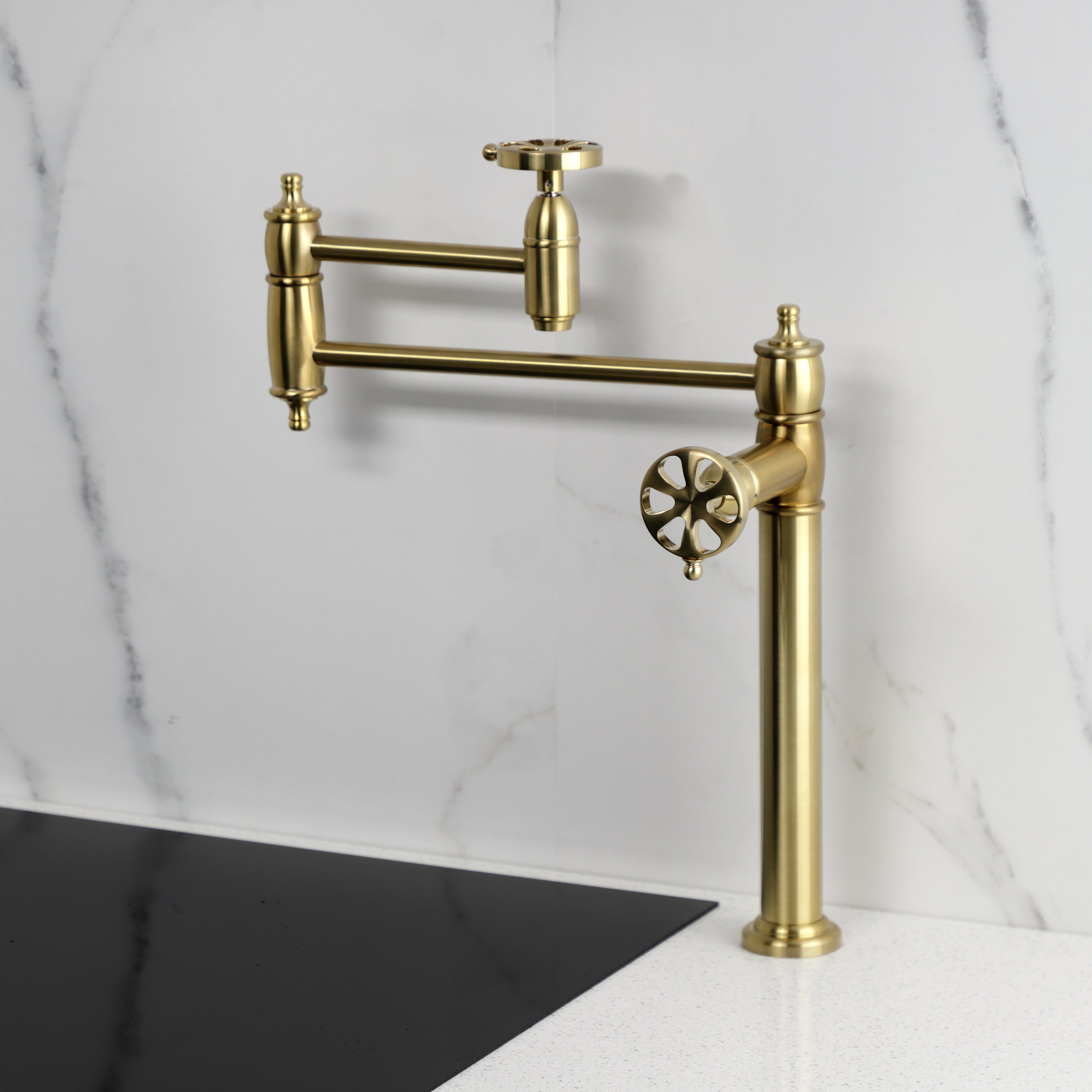 Kingston Brass KS3703RX Belknap Deck Mount Pot Filler Faucet, Antique Brass on white marble backdrop