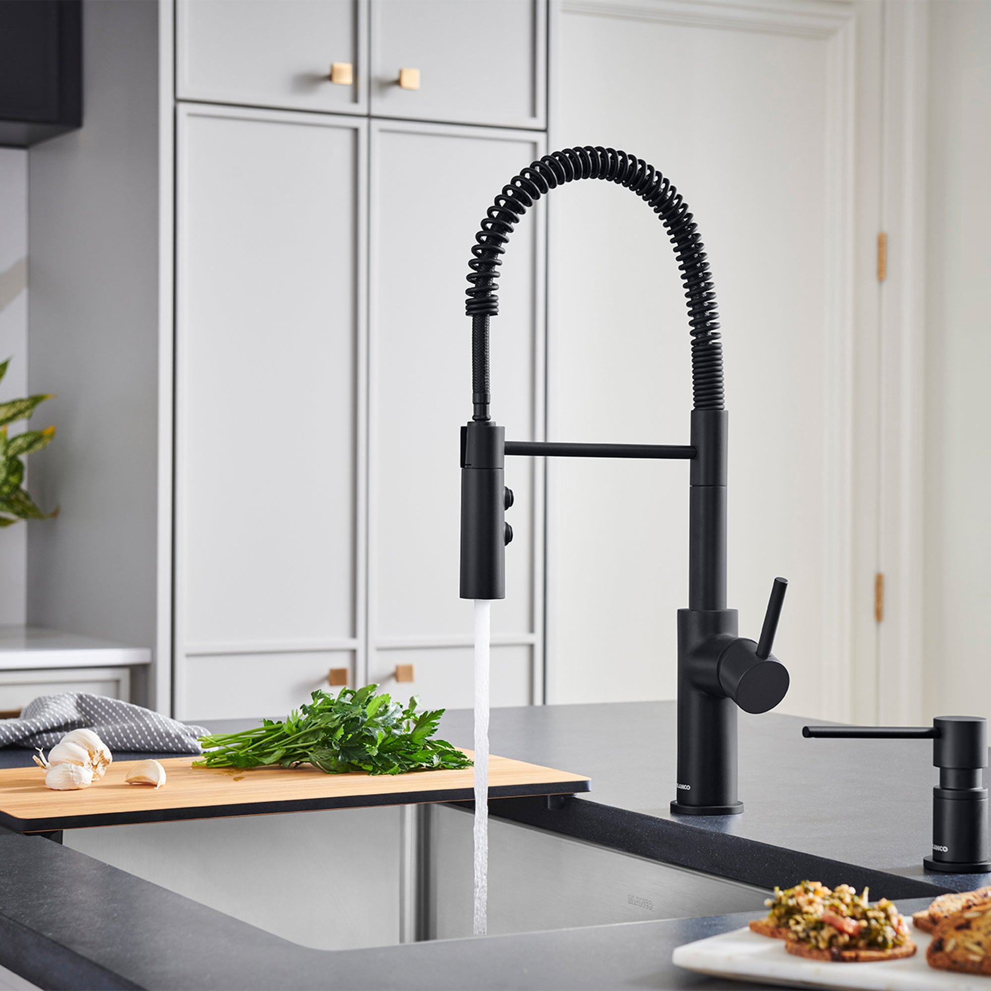 BLANCO Catris Semi-Pro Pull-Down Dual-Spray Kitchen Faucet in a modern kitchen setup with spring-coil design.