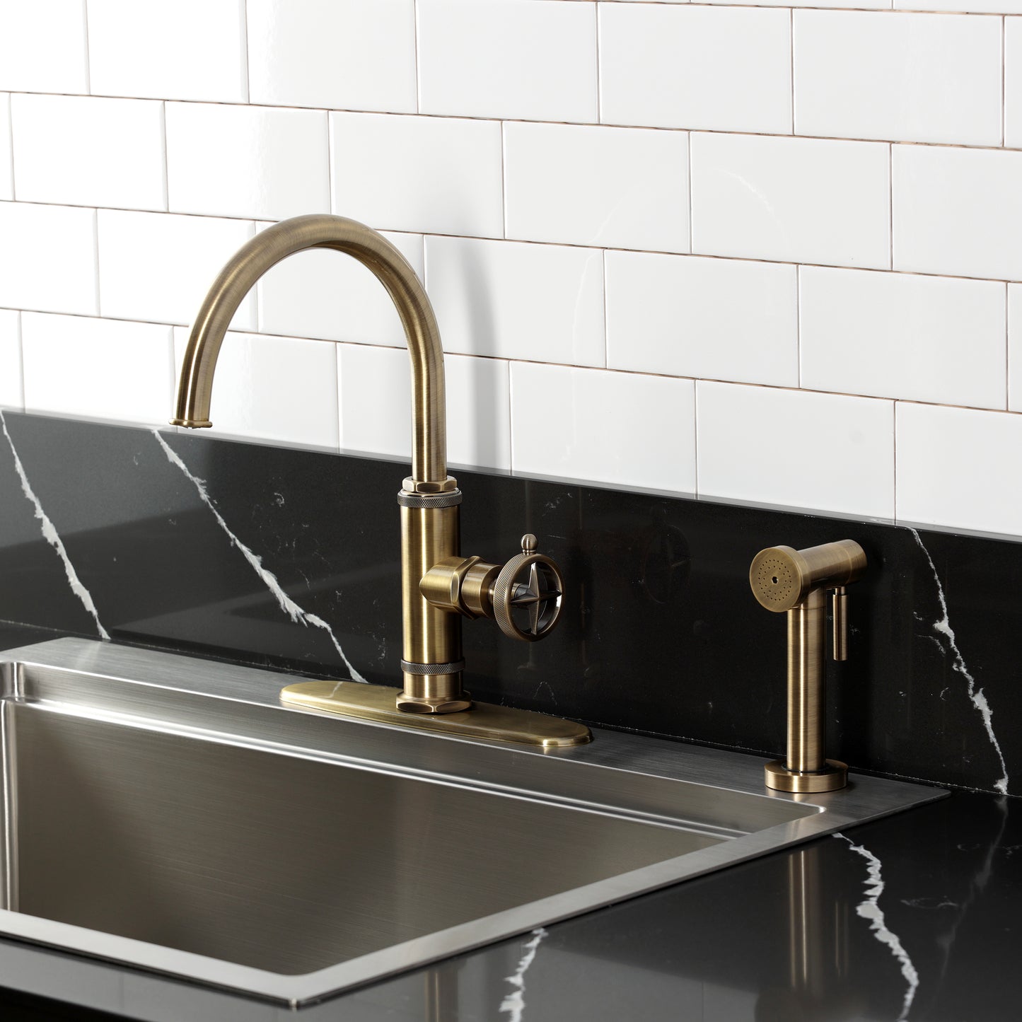 Kingston Brass KSD2433RNK Levante Single-Handle Kitchen Faucet, Antique Brass on a modern kitchen countertop