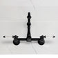 Kingston KS1263WLL Willshire Two-Handle Wall Mount Bridge Kitchen Faucet, Antique Brass on a marble countertop.