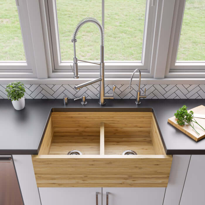 ALFI BRAND 33" Double Bowl Bamboo Farmhouse Sink - AB3321 displayed in a modern kitchen with stainless steel fixtures.