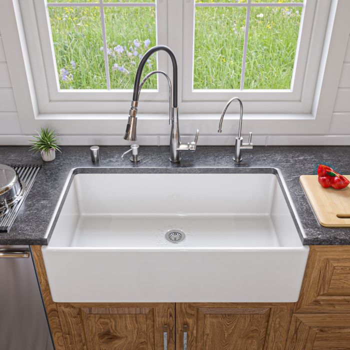 ALFI 36" Smooth Apron Single Bowl Fireclay Farm Sink AB536-W in a modern kitchen with stylish fixtures.