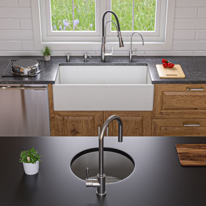 ALFI 36" Smooth Apron Single Bowl Fireclay Farm Sink AB536-W installed in a modern kitchen with elegant fixtures.