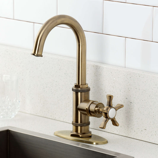 Kingston Brass KSD8503NX Hamilton Single-Handle Bar Faucet, Antique Brass installed on a countertop.