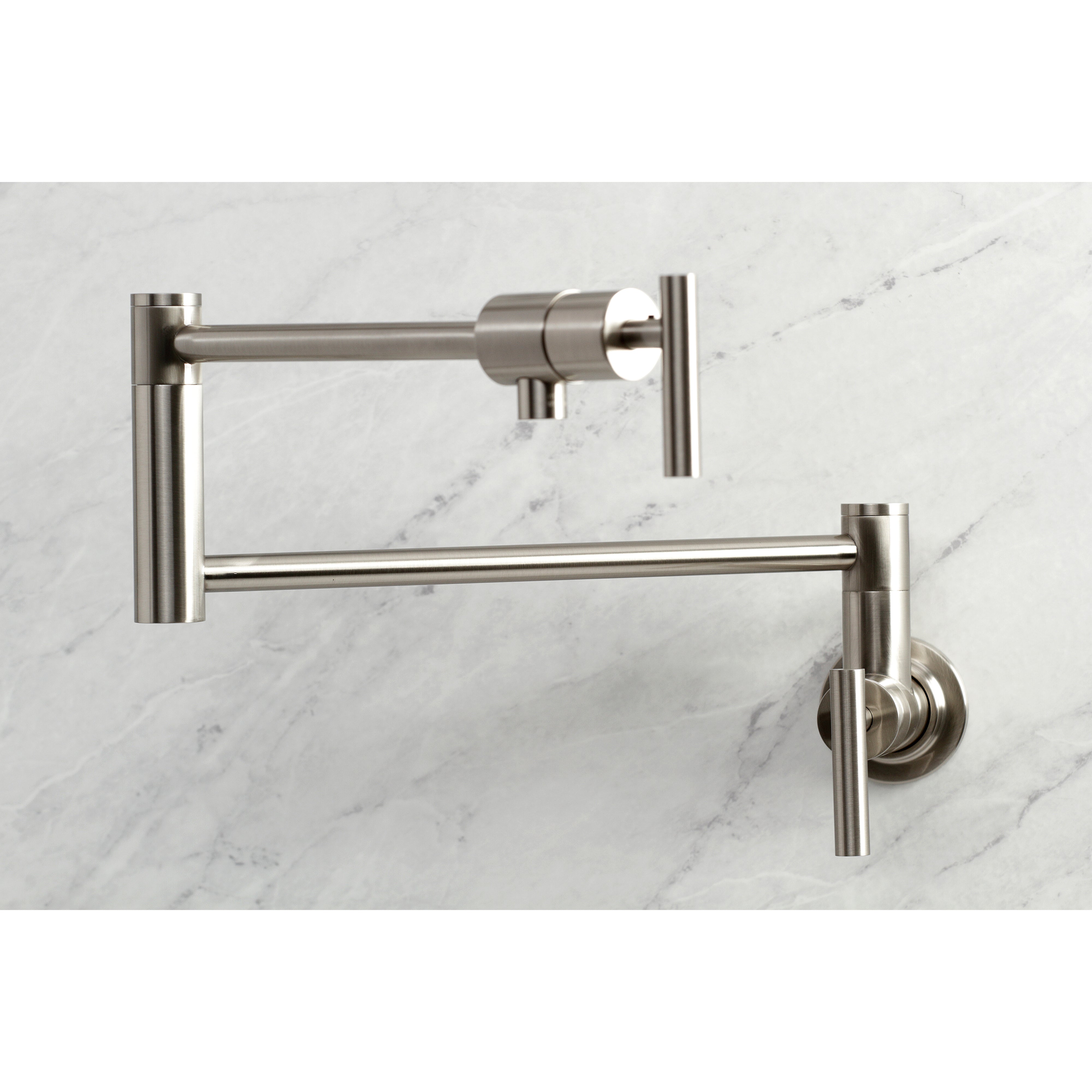 Kingston Brass KS4103CML Manhattan Wall Mount Pot Filler Faucet, Antique Brass on marble background