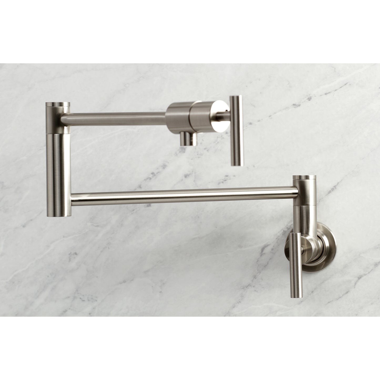 Kingston Brass KS4103CML Manhattan Wall Mount Pot Filler Faucet, Antique Brass on marble background