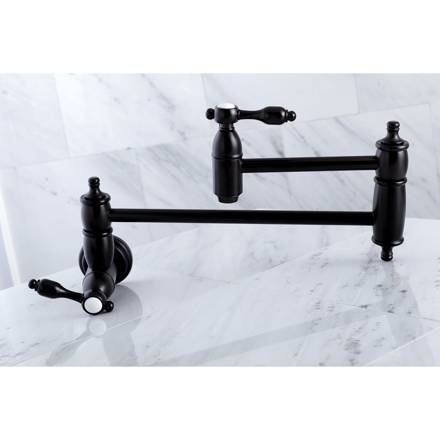 Kingston Brass KS3103TAL Tudor Wall Mount Pot Filler Faucet, Antique Brass on marble countertop