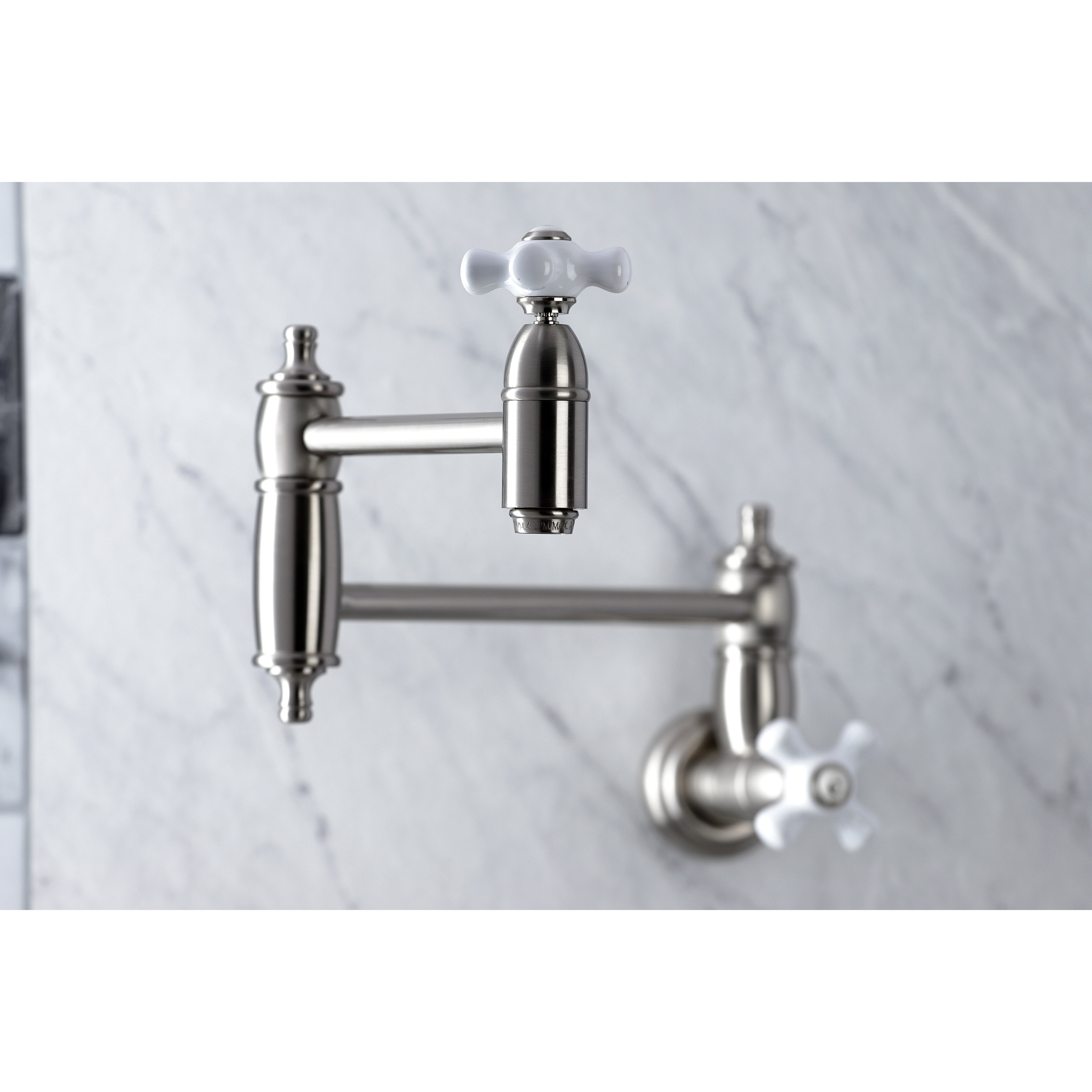 Kingston Brass KS310PXAC Restoration Wall Mount Pot Filler Faucet, Antique Copper with elegant design and foldable swing arms.