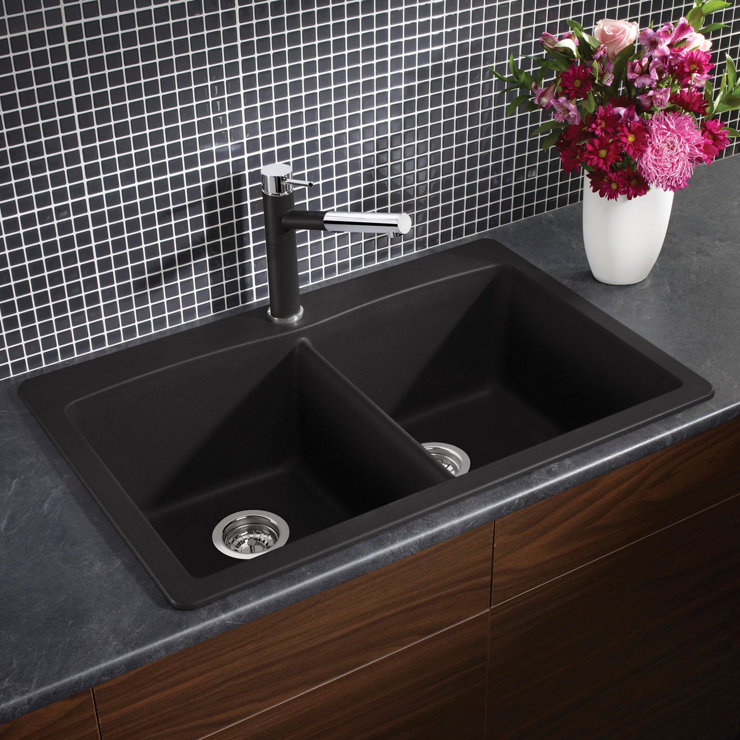 BLANCO Diamond SILGRANIT 33" 50/50 Double Bowl Dual Mount Kitchen Sink with stylish faucet and flowers.