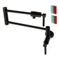 Kingston Brass KS4103DKL Kaiser Wall Mount Pot Filler Faucet, Antique Brass with black silicone rubber handles.