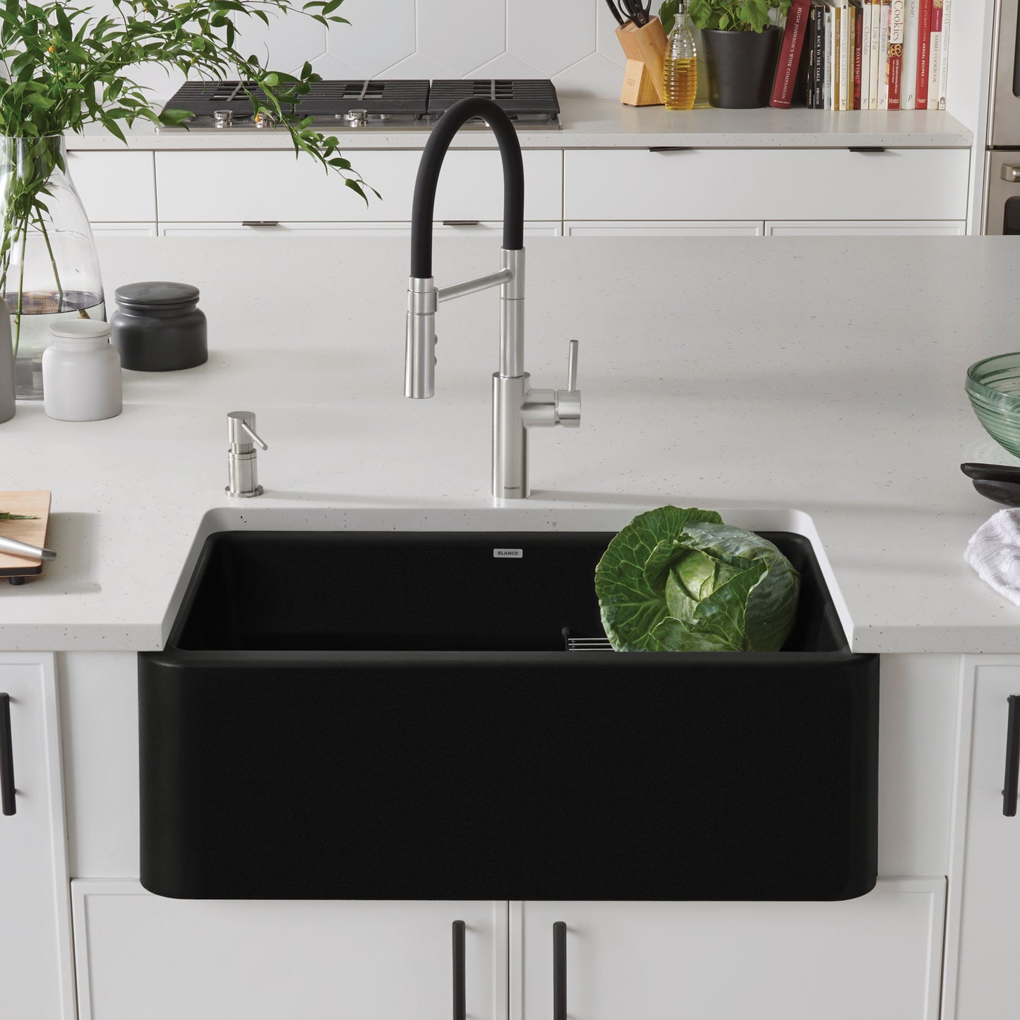 BLANCO Ikon SILGRANIT 30" Single Bowl Apron-Front Farmhouse Sink with fresh vegetables on countertop in modern kitchen.