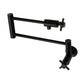 Kingston Brass KS4103DX Concord Wall Mount Pot Filler Faucet, Antique Brass in matte black finish.