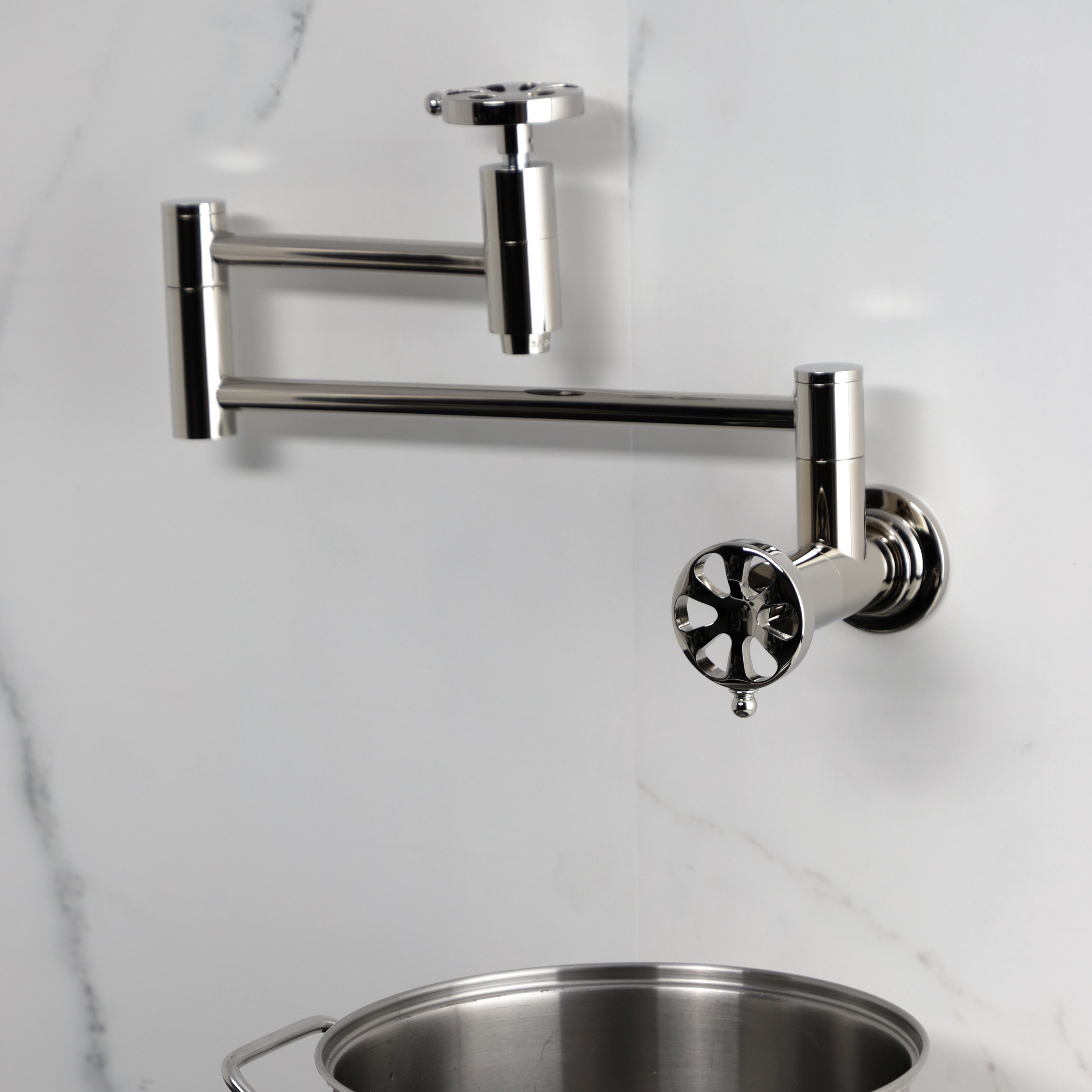 Kingston Brass KS8103RX Belknap Wall Mount Pot Filler Faucet, Antique Brass, stylish design with foldable swing arms.