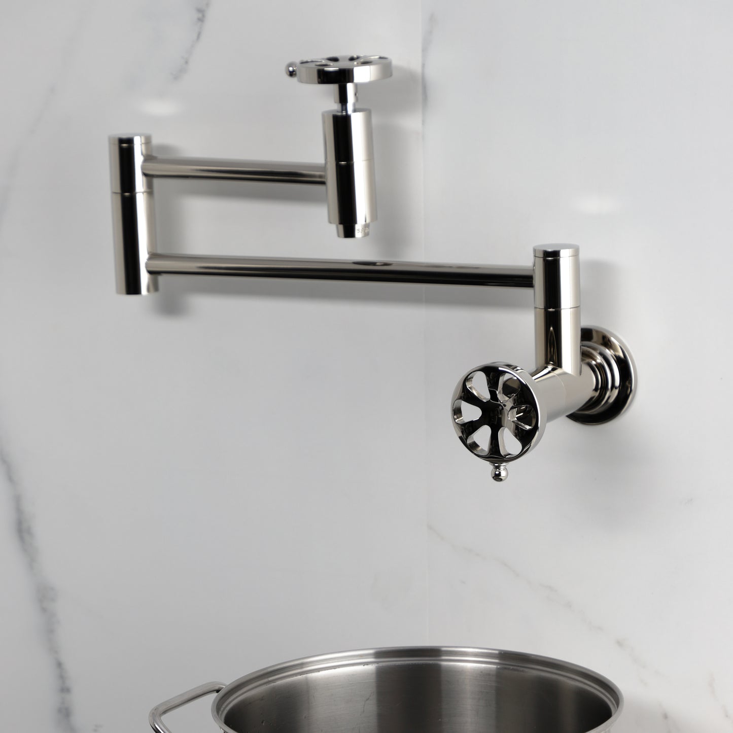 Kingston Brass KS8103RX Belknap Wall Mount Pot Filler Faucet, Antique Brass, stylish design with foldable swing arms.