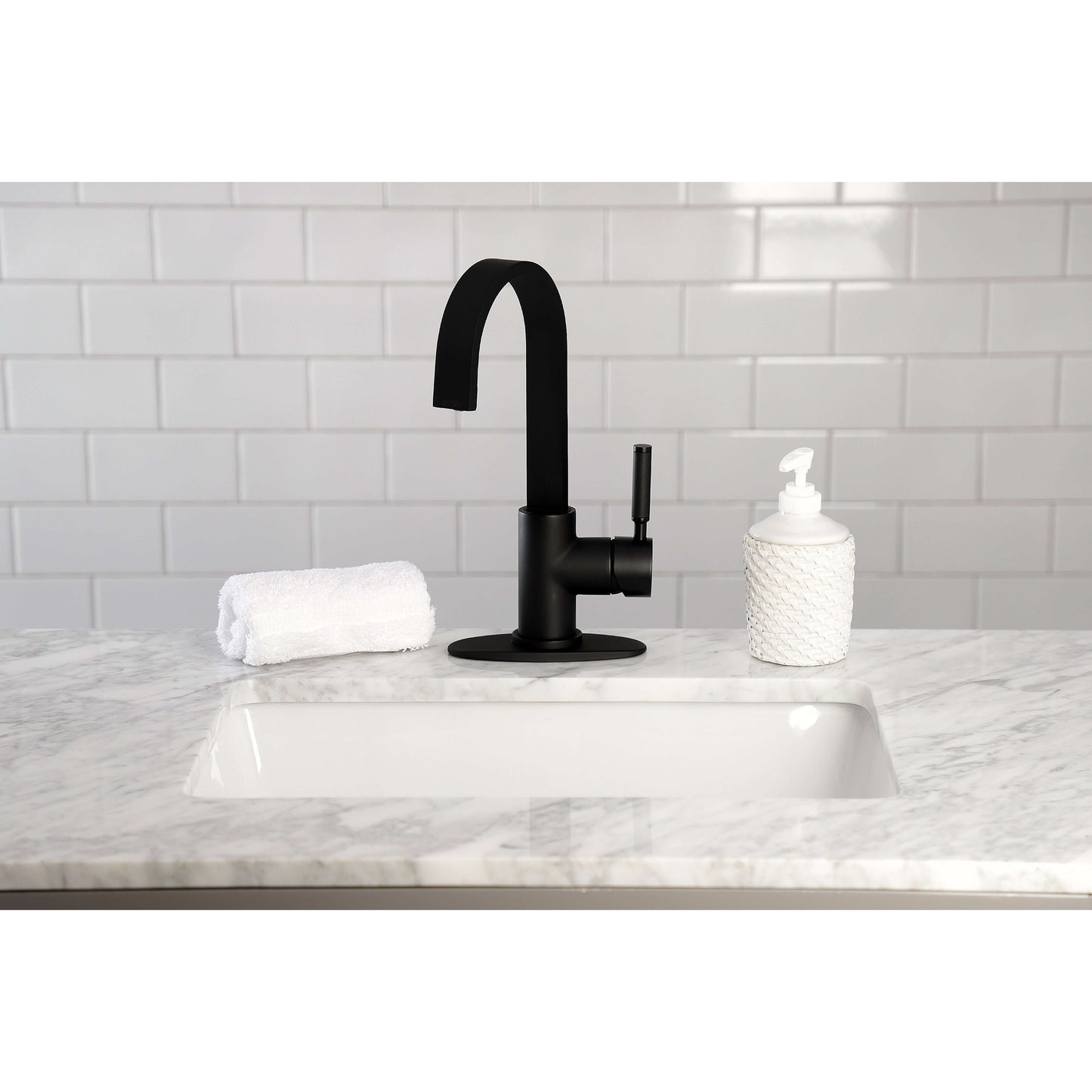 Kingston Brass LS8618DKL Kaiser Single-Handle Bar Faucet displayed on a marble countertop with a white towel and soap dispenser.