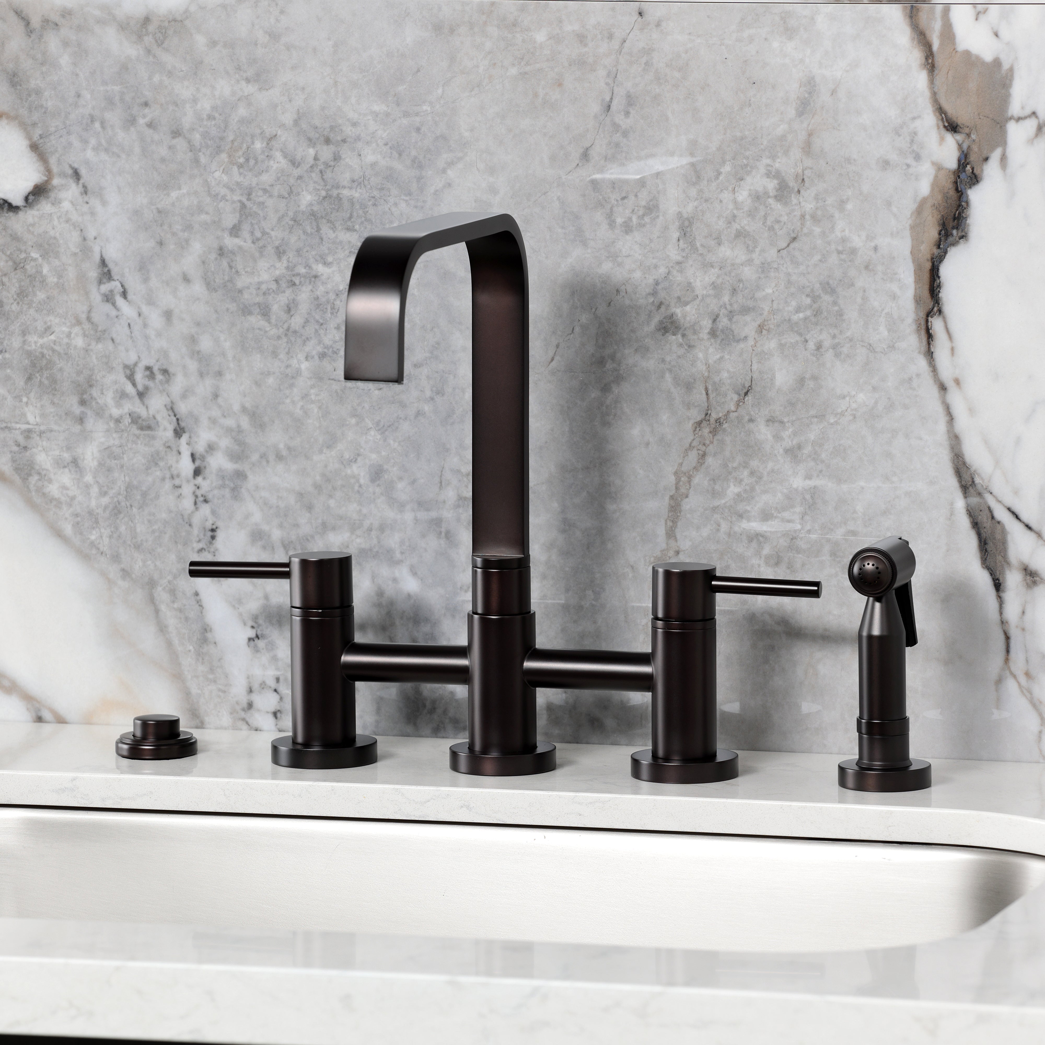 Kingston KS8257DLBS Concord Bridge Kitchen Faucet with Brass Sprayer, Brushed Brass on modern sink.